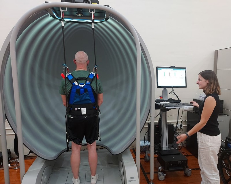 Cover photo of article depicting a participant walking with motion sensors