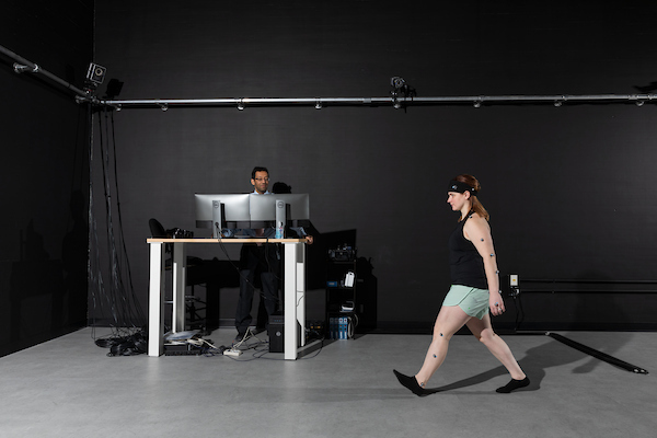Cover photo of article depicting a participant walking with motion sensors