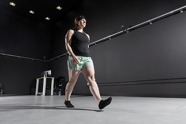 Cover photo of article depicting a participant walking with motion sensors